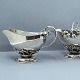 Georg Jensen silver.Georg Jensen; A sugar bowl and creamer of hammered sterling silver.Sugar ...