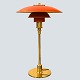 Poul 
Henningsen; PH 
3/2 table lamp, 
with red 
lacquered shade
