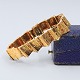 Toftegaard; 
Bracelet in 14k 
gold. Composed 
of links with 
rustic surface. 
With clasp, and 
two ...
