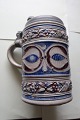 Antique mug with a lid of tin/pewterPotteryH: 17cm (see photo)StampedIn a very good ...