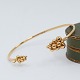 Georg Jensen; A 
Moonlight 
Grapes bangle 
in 18k gold, 
set with 
diamonds.
Size L. dia. 
4,8-6,2 ...