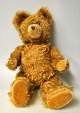 Gammel bamse, 20. årh. Gult loden plyds. H: 40 cm. 