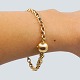 Ole Lynggaard; Lille Otte-tals armbånd i 14 kt. guld med ...
