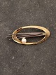 14 karat guld broche med ægte perle