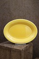 Ursula fad i fajance fra Royal Copenhagen designet af Ursula Munch-Petersen i gul glasur. ...