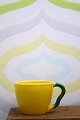 Ursula kaffekop i fajance fra Royal Copenhagen designet af Ursula Munch-Petersen  i gul glasur ...