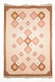 Swedish Rölakan rug.Handwoven Swedish Rölakan wool rug with stylised floral motifs in pink, ...