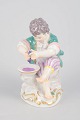 Meissen, dreng med druepresse.Porcelænsfigur forestillende en dreng, der presser druer over en ...