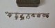 Vintage sølv barnearmbånd med 8 charms