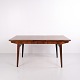 Vintage Danish Modern rosewood dining table designed by Johannes Andersen and manufactured by ...