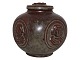 Royal Copenhagen art pottery, lidded bowl decorated with faces and a cat on the lid.Designed ...