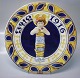 1916 Den kongelige porcelænsfabriks Store Juleplatter af Fajance fra Aluminia 
1109-977 Julerelief 1916 Jesusbarnet i svøb R. Harboe 30 cm 
