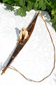 Grønlandsk kajak, med diverse fangstredskaber lavet af træ, skind og ben. Længde 63cm.