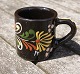 Swedish ceramics, set of 4 small mugs 6cm with black glaze and with decoration.