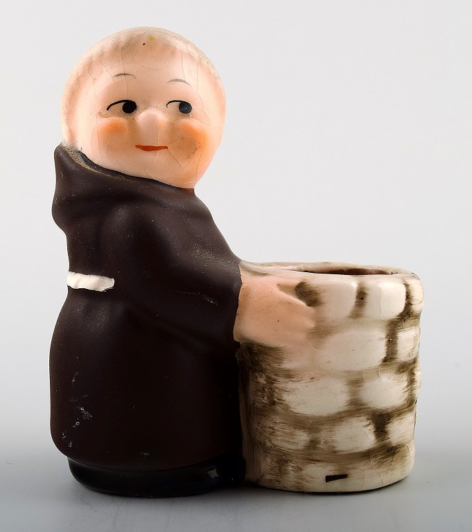 Hummel figurine of a monk.
