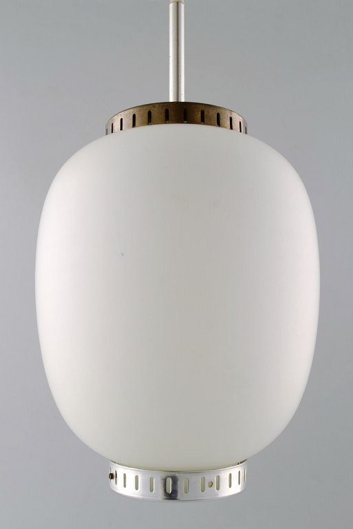 Bent Karlby: "The China light". Danish design.
Pendant in matte opal glass with brass fitting.