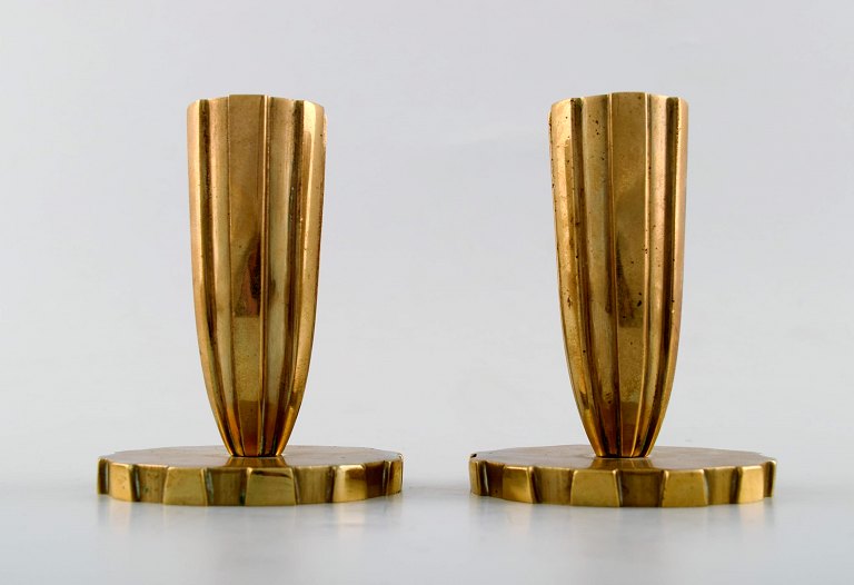 Tinos style art deco, a pair of candlesticks in bronze. Vendor, Copenhagen.