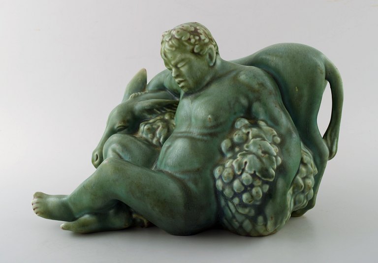 Harald Salomon for Rörstrand, green glazed pottery figure of bacchus and donkey.