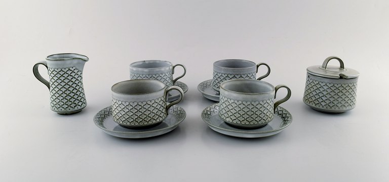 Bing & Grondahl number 305. Set of 4 tea cups with saucers and a jug and sugar 
bowl.
B & G Grey Cordial Quistgaard Nissen Kronjyden stoneware .