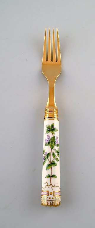 Michelsen for Royal Copenhagen. "Flora Danica" frokostgaffel af forgyldt 
sterlingsølv. Skafte af porcelæn dekoreret i farver og guld med blomster.