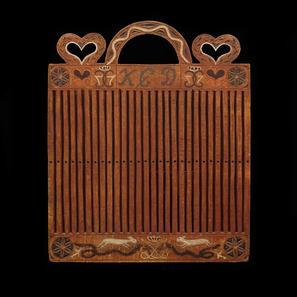 A Danish 19th century rigid heddle. Dated 1825. H: 32cm. W: 26cm