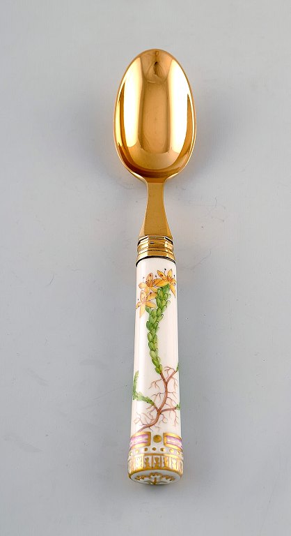 Georg Jensen for Royal Copenhagen. "Flora Danica" dinner spoon of gold plated 
sterling silver. Porcelain handle decorated in colors and gold with flowers.