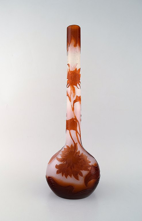 Early, monumental Emile Gallé vase in clear frosted and overlaid red-brown art 
glass carved with motifs in the form of flowers and leaves. 1890