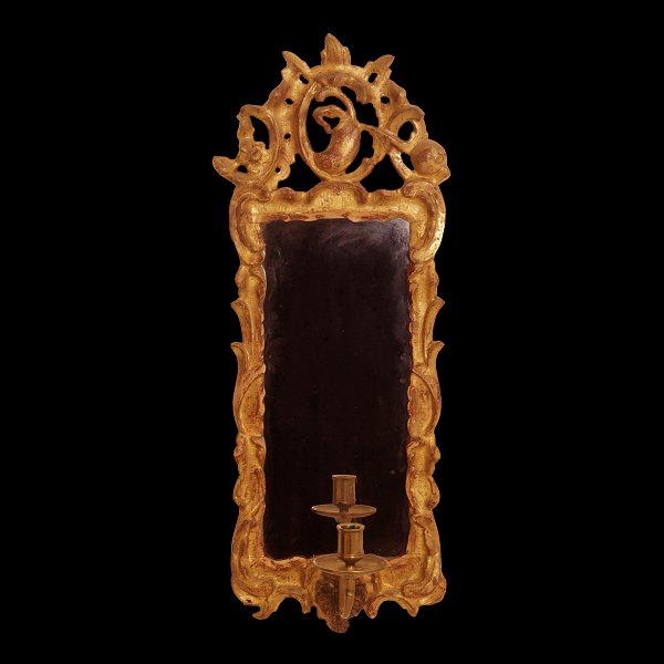 A gilt 18th century Rococo mirror. Northgermany circa 1760. H: 59cm. W: 22cm