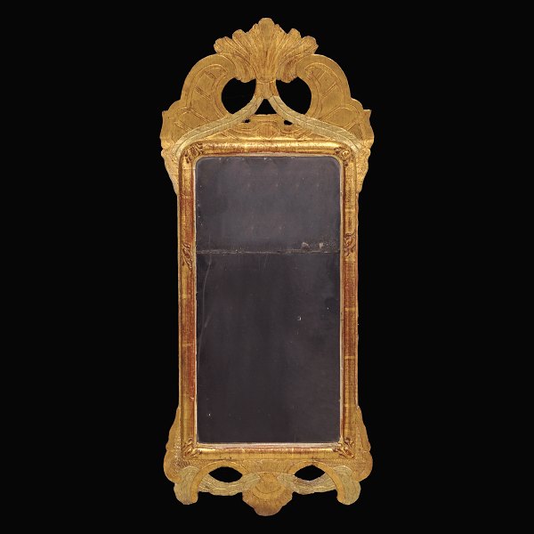 A gilt Gustavian mirror signed Stockholm 177... Sweden circa 1775. Size: 70x30cm