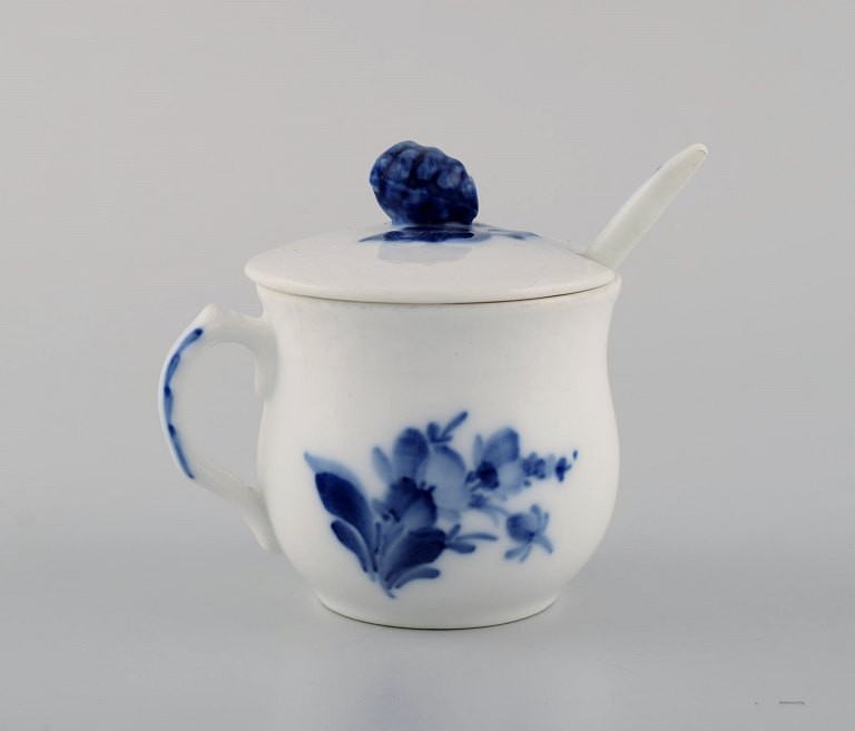 Royal Copenhagen blue flower braided cream cup with porcelain spoon.
