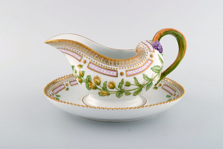 Royal Copenhagen Flora Danica sauce boat in hand-painted porcelain with flowers 
and gold decoration. Model number 20/3556.
