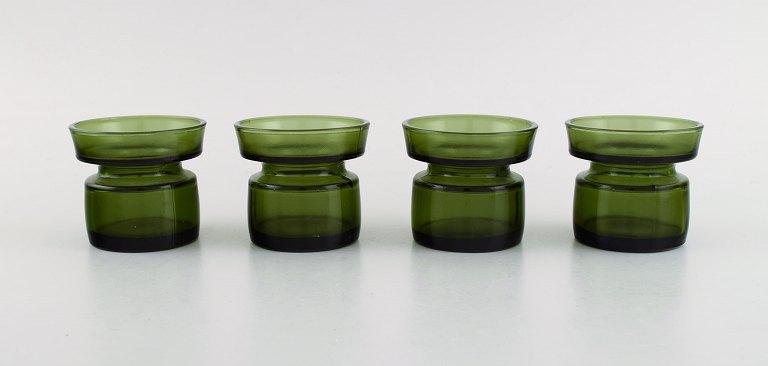 Jens Harald Quistgaard. Four "Hygge" light holders for teacandles in dark green 
art glass. Retro, 1960