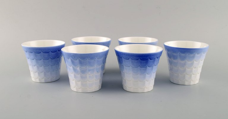 Wilhelm Kåge for Gustavsberg. Six flower pot covers in porcelain. Swedish 
design, 1960s.
