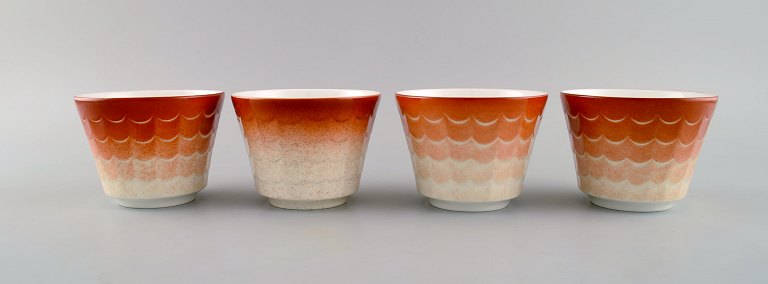 Wilhelm Kåge for Gustavsberg. Four flower pot covers in porcelain. Swedish 
design, 1960s.
