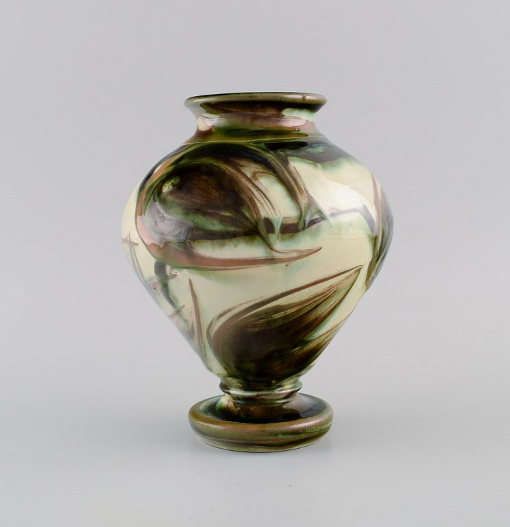 Kähler, Denmark. Vase in glazed ceramics. Flowers on a cream colored background. 
Modern design, 1930s / 40s.
