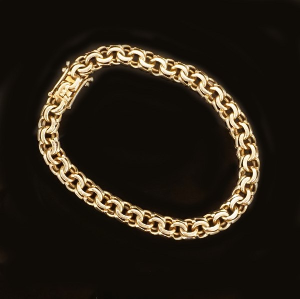 14kt gold bracelet by Bremer Jensen, Randers, Denmark. L: 19,5cm. W: 7mm. W: 
20gr