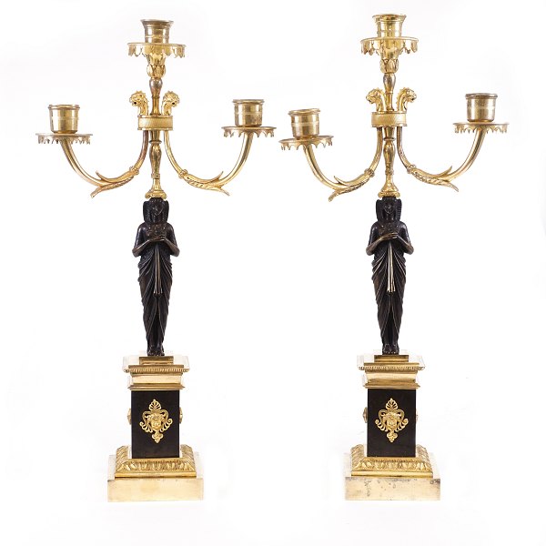 A pair of fire gilt Empire bronze candelabra. France circa 1820. H: 51cm