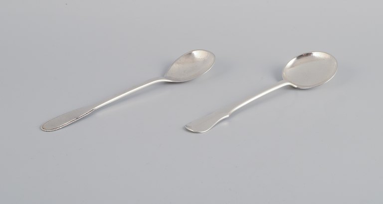 Evald Nielsen, Danish silversmith, two hammered sugar spoons in Danish 830 
silver. One spoon model number 14.