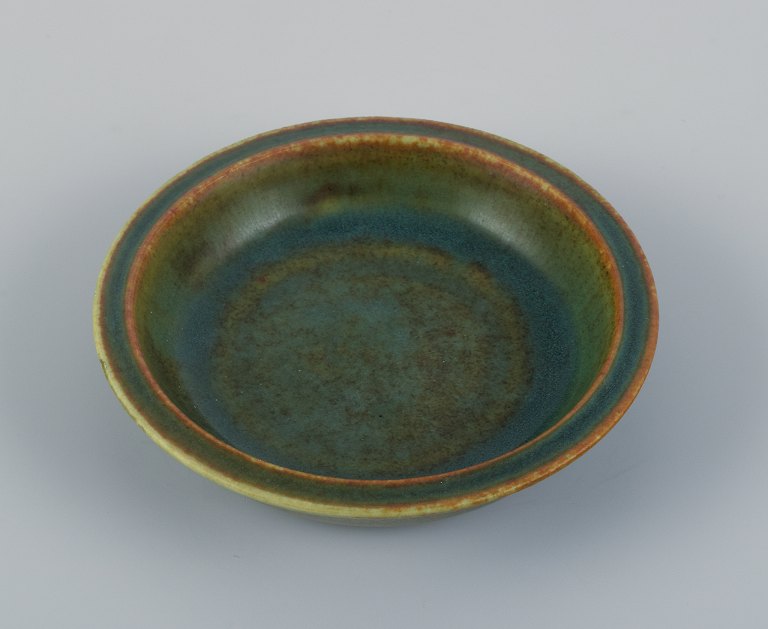 Eva Stæhr Nielsen for Saxbo, small ceramic bowl with glaze in green, blue and 
brown tones.