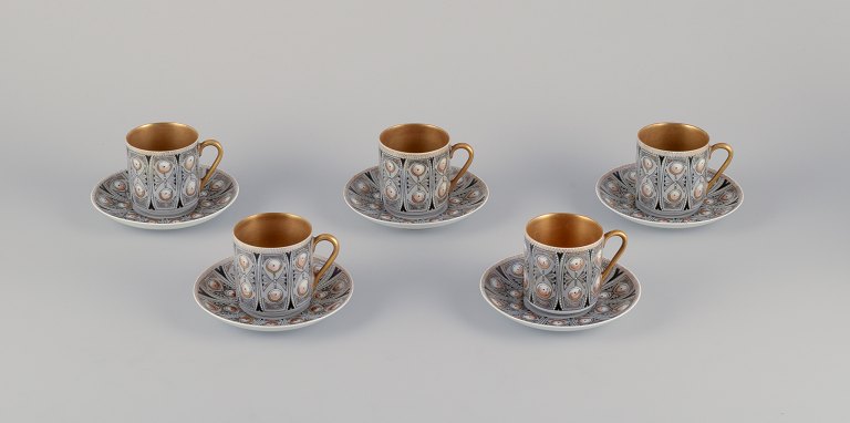 Raija Uosikkinen, Arabia, a set of five "Asta" coffee cups with saucers. 
Hand-decorated in a modernist style.