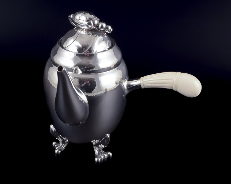 Georg Jensen Blossom coffee pot in hand hammered sterling silver with bone 
handle.
