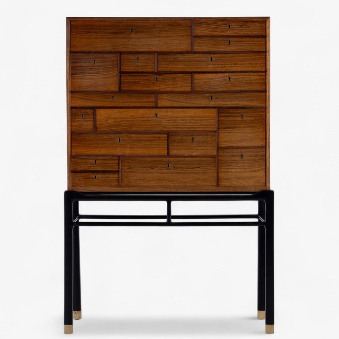 Jørgen Berg / William Christensen.Rare cabinet in rosewood with drawers and black lacquered frame with brass shoes.1 pc. in stock